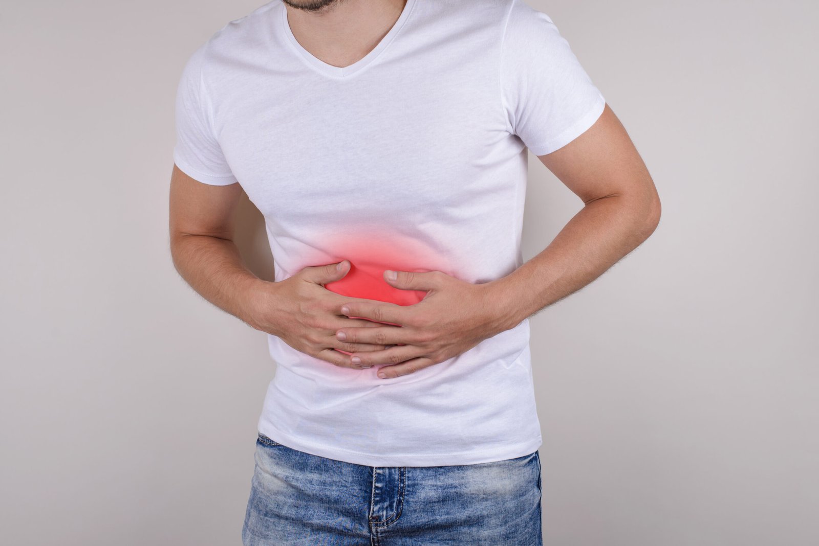 Cropped Close Up Studio Photo Portrait Upset Sad Scared Worried Troubled Gut Having Stomach Ache Disorder Wear Denim Pants Isolated Grey Background Scaled