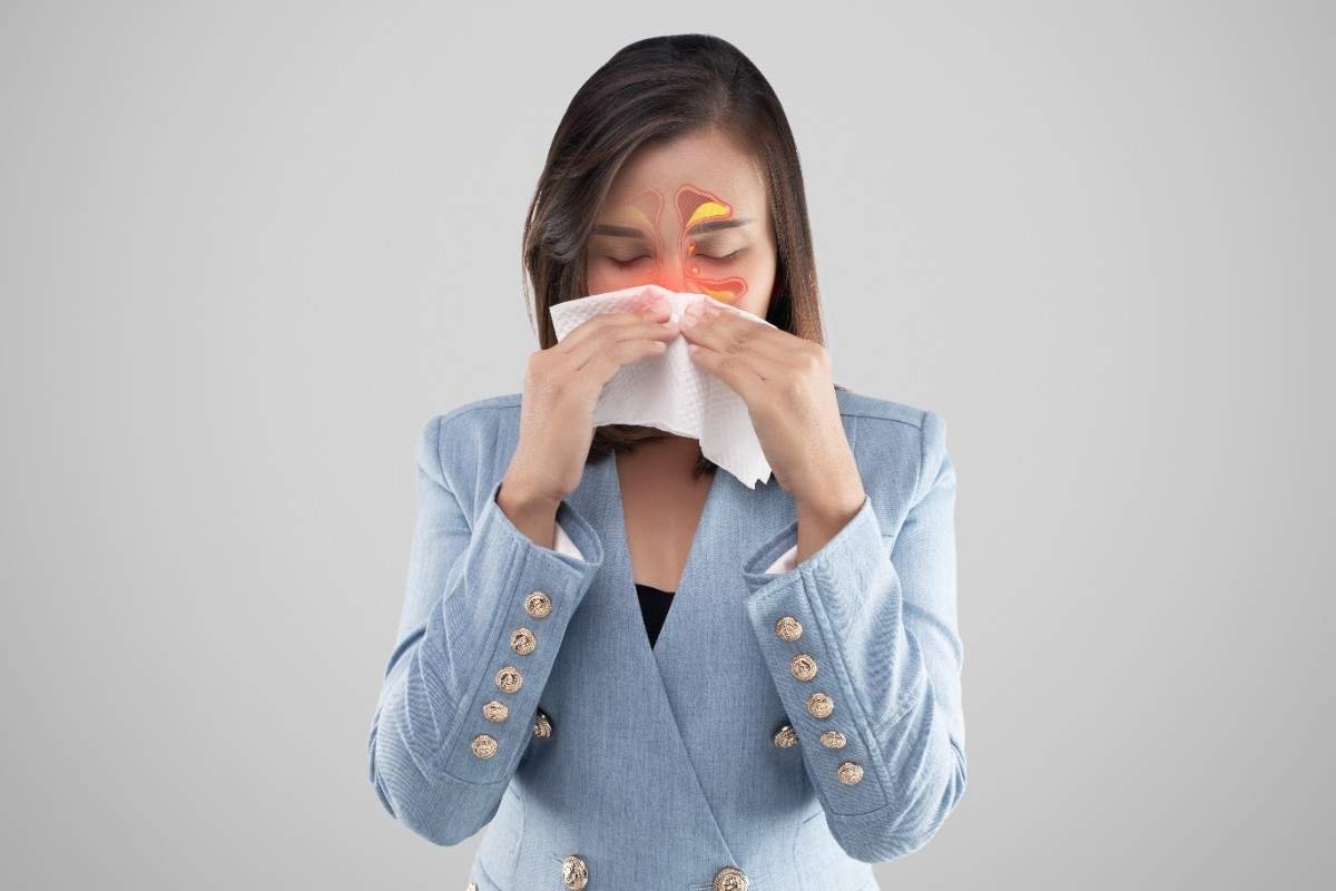 asian woman feeling unwell because sinus symptoms gray (1)